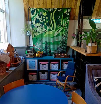 the childrens corner with toys and games at cafe recharge in galashiels