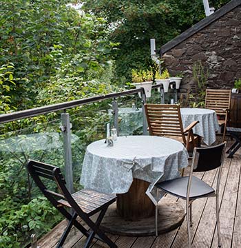 the tranquil riverside terrace at cafe recharge in galashiels