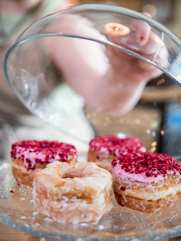 Strawberry Yumnuts under a glass cloche at cafe recharge in Galashiels