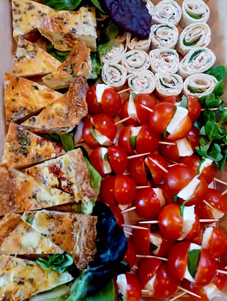 quiche bites, mozzarella and tomato skewers and cream chees pinwheels boxed for catering at cafe recharge in galashiels